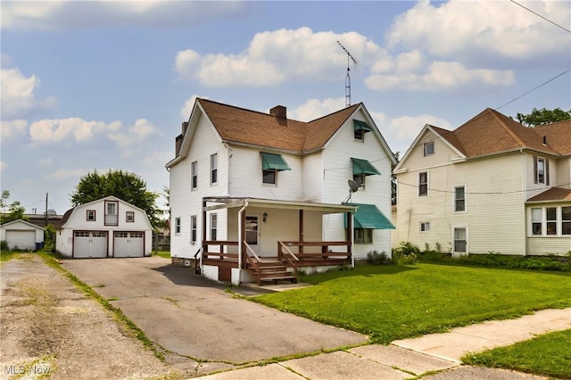 125 N Arlington Ave, Niles, OH 44446 - view of front of property with a garage, an outdoor structure, a front lawn, covered porch, and a chimney