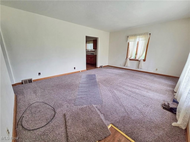 5197 Atchison Rd, Bellaire, OH 43906 - carpeted empty room with baseboards