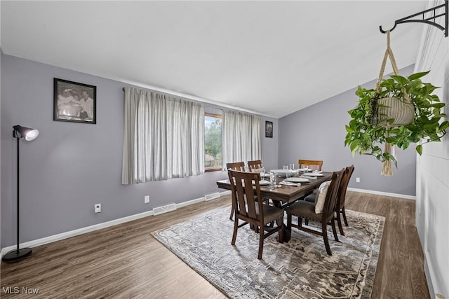 321 Stuart St NW, Lehigh Twp, OH 44646 - dining area featuring wood finished floors and vaulted ceiling