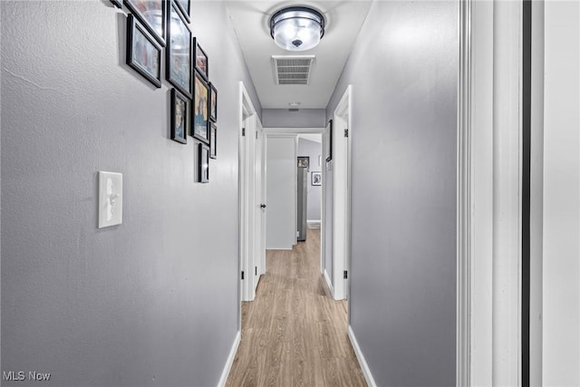 321 Stuart St NW, Lehigh Twp, OH 44646 - corridor featuring light wood-style floors and baseboards
