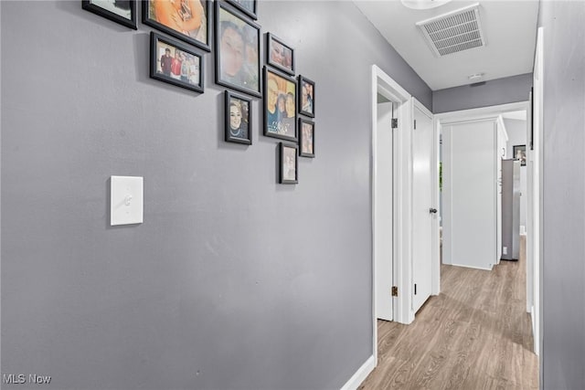 321 Stuart St NW, Lehigh Twp, OH 44646 - corridor featuring wood finished floors and baseboards