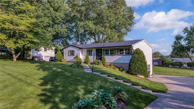 321 Stuart St NW, Lehigh Twp, OH 44646 - view of front of home featuring a front yard and a chimney