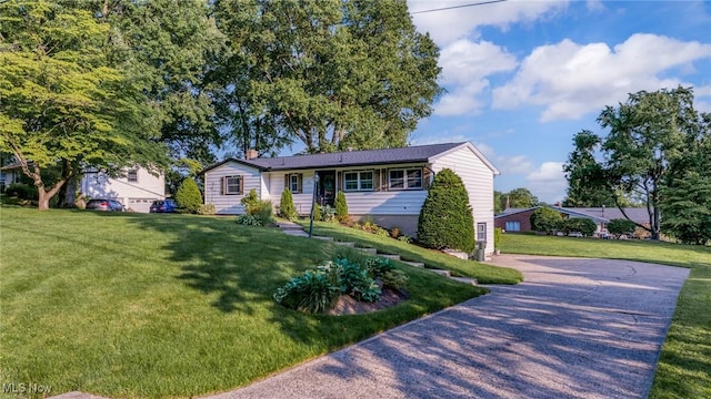 321 Stuart St NW, Lehigh Twp, OH 44646 - view of front of house featuring a front yard