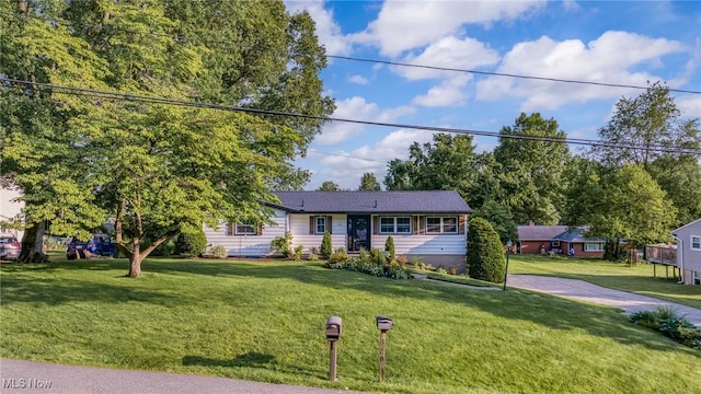 321 Stuart St NW, Lehigh Twp, OH 44646 - ranch-style house with a front lawn