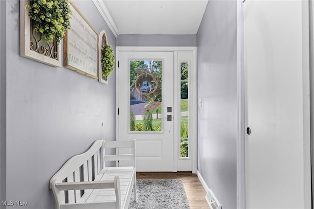 321 Stuart St NW, Lehigh Twp, OH 44646 - doorway to outside featuring wood finished floors and baseboards