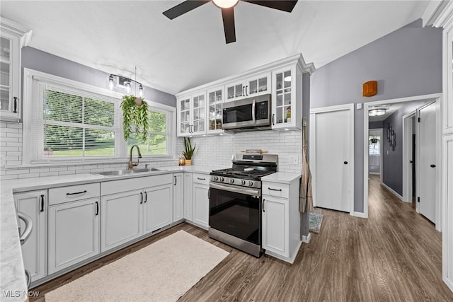 321 Stuart St NW, Lehigh Twp, OH 44646 - kitchen featuring stainless steel appliances, backsplash, a ceiling fan, dark wood finished floors, and light countertops