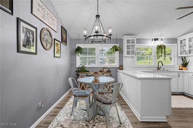 321 Stuart St NW, Lehigh Twp, OH 44646 - dining room with dark wood-style flooring and a chandelier