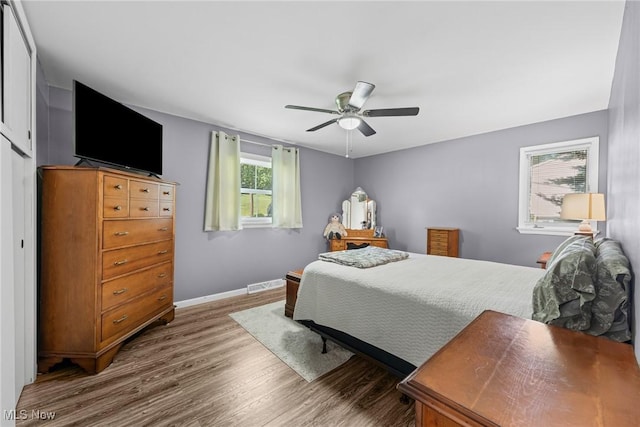 321 Stuart St NW, Lehigh Twp, OH 44646 - bedroom featuring wood finished floors and ceiling fan