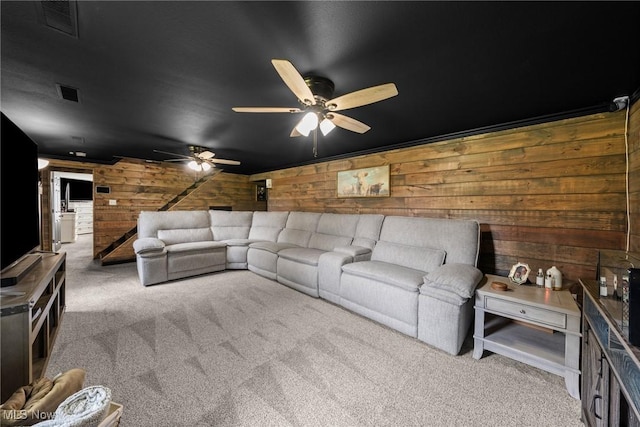 321 Stuart St NW, Lehigh Twp, OH 44646 - carpeted living area with wooden walls and ceiling fan