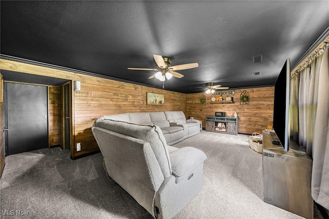 321 Stuart St NW, Lehigh Twp, OH 44646 - carpeted living room with wood walls and a ceiling fan