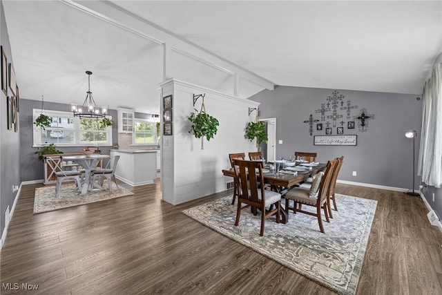 321 Stuart St NW, Lehigh Twp, OH 44646 - dining space with dark wood finished floors and a chandelier