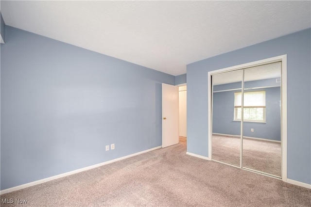 10790 Ravenna Rd Unit 302, Twinsburg, OH 44087 - unfurnished bedroom with carpet floors and a closet