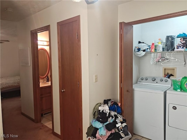 3211 Latimer Ave, Ashtabula, OH 44004 - laundry room with washer and clothes dryer and light colored carpet