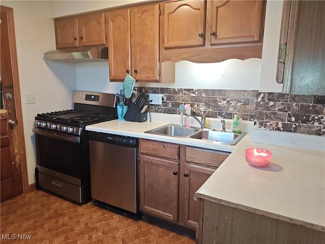 3211 Latimer Ave, Ashtabula, OH 44004 - kitchen with stainless steel appliances, wall chimney range hood, light countertops, and tasteful backsplash