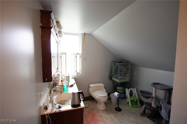 4896 High Hill Rd, Cambridge, OH 43725 - bathroom featuring lofted ceiling, vanity, and wood finished floors