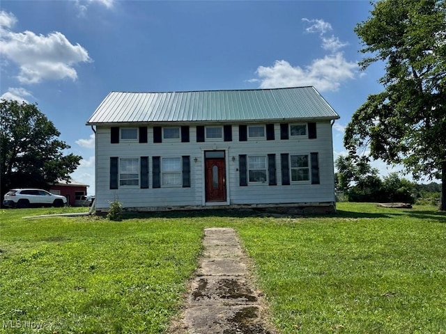 4896 High Hill Rd, Cambridge, OH 43725 - colonial home with a front lawn and a metal roof