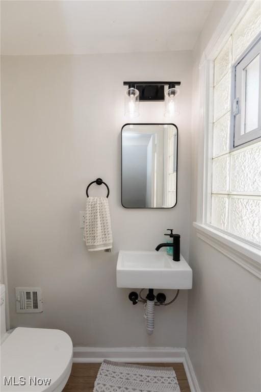4410 Silsby Rd, University Heights, OH 44118 - bathroom with a sink and wood finished floors