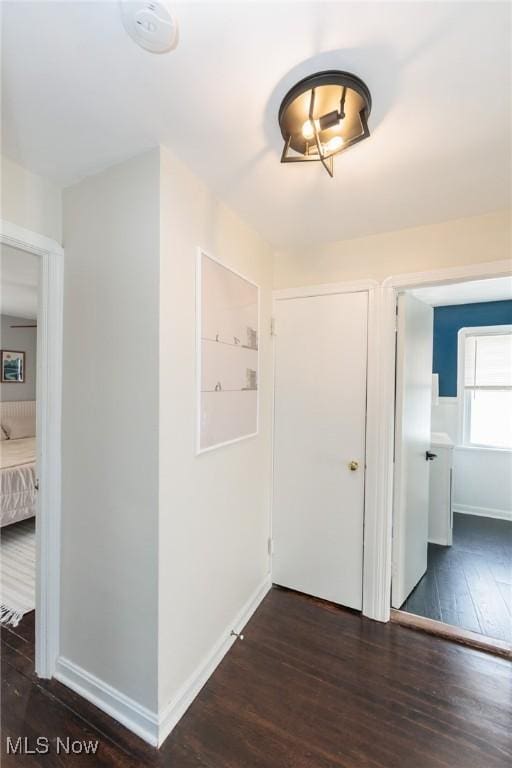 4410 Silsby Rd, University Heights, OH 44118 - hallway featuring dark wood-style flooring and baseboards