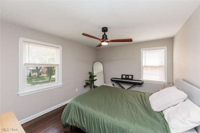 4410 Silsby Rd, University Heights, OH 44118 - bedroom with multiple windows, dark wood-style flooring, and ceiling fan