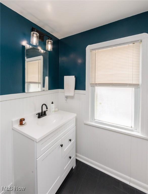 4410 Silsby Rd, University Heights, OH 44118 - bathroom featuring vanity and wainscoting