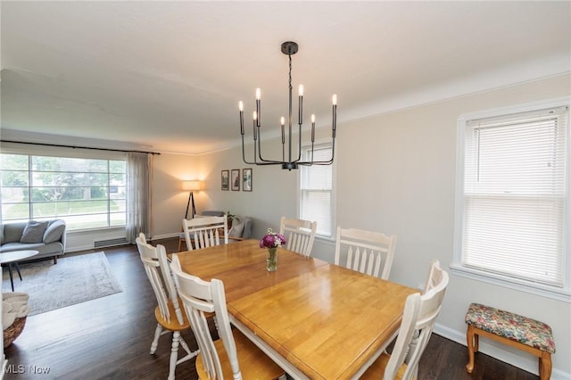 4410 Silsby Rd, University Heights, OH 44118 - dining area with dark wood-style flooring and a chandelier