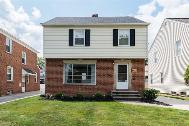 4410 Silsby Rd, University Heights, OH 44118 - colonial home featuring entry steps, brick siding, and a front yard