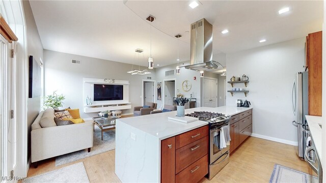1846 Front St Unit 402, Cuyahoga Falls, OH 44221 - kitchen with island range hood, appliances with stainless steel finishes, light wood-type flooring, a peninsula, and recessed lighting