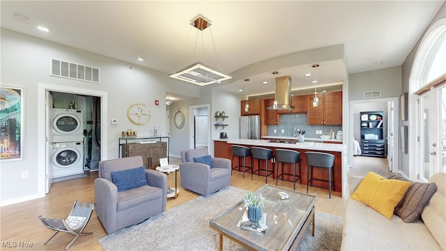 1846 Front St Unit 402, Cuyahoga Falls, OH 44221 - living room featuring stacked washer / drying machine, light wood finished floors, and recessed lighting
