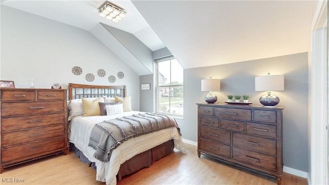 1846 Front St Unit 402, Cuyahoga Falls, OH 44221 - bedroom featuring vaulted ceiling and light wood finished floors