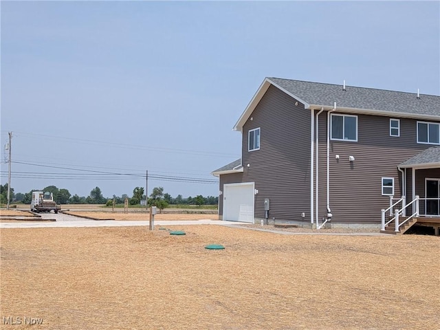 41861 State Route 303, Lagrange, OH 44050 - view of side of home with roof with shingles
