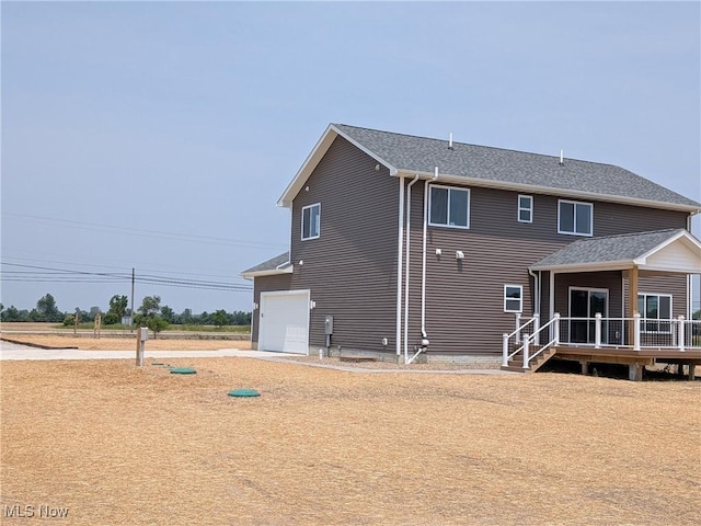 41861 State Route 303, Lagrange, OH 44050 - rear view of property with a deck and roof with shingles