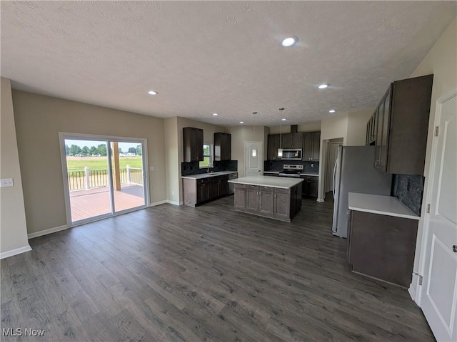 41861 State Route 303, Lagrange, OH 44050 - kitchen with appliances with stainless steel finishes, decorative backsplash, a center island, open floor plan, and recessed lighting