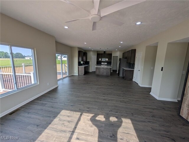 41861 State Route 303, Lagrange, OH 44050 - unfurnished living room with ceiling fan, dark wood finished floors, a textured ceiling, and recessed lighting