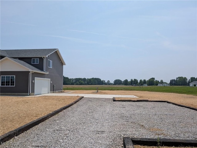 41861 State Route 303, Lagrange, OH 44050 - view of yard featuring a garage and driveway