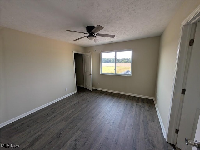 41861 State Route 303, Lagrange, OH 44050 - spare room featuring a ceiling fan, dark wood-type flooring, and a textured ceiling