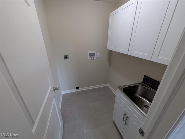41861 State Route 303, Lagrange, OH 44050 - washroom with electric dryer hookup, washer hookup, cabinet space, and tile patterned flooring