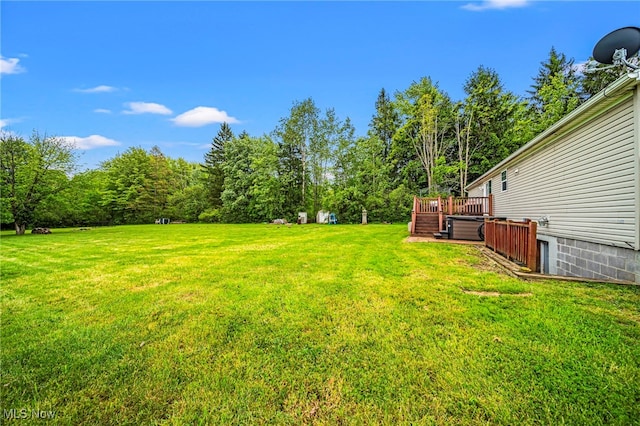 6835 Sidley Rd, Thompson, OH 44086 - view of green lawn featuring a deck