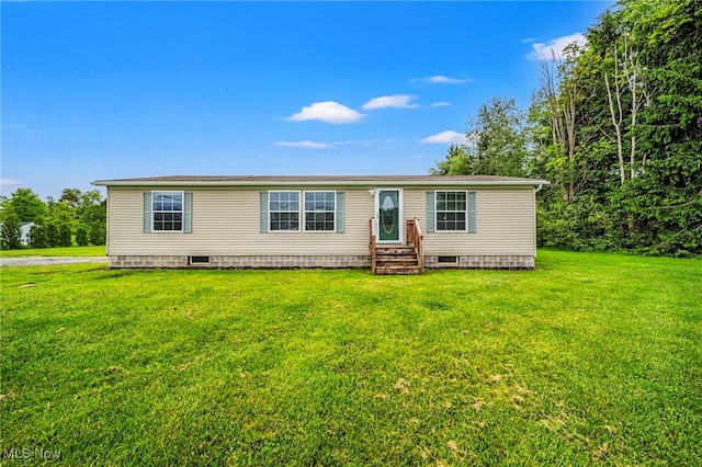 6835 Sidley Rd, Thompson, OH 44086 - manufactured / mobile home featuring entry steps, a front yard, and crawl space