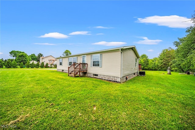 6835 Sidley Rd, Thompson, OH 44086 - rear view of property featuring a lawn