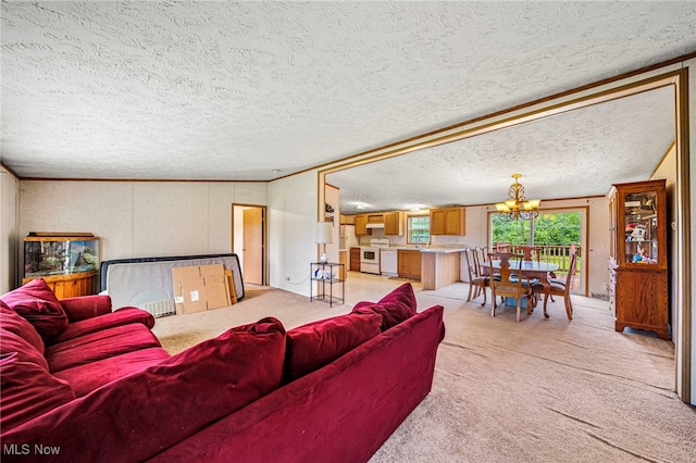 6835 Sidley Rd, Thompson, OH 44086 - living room featuring a chandelier, light colored carpet, and a textured ceiling