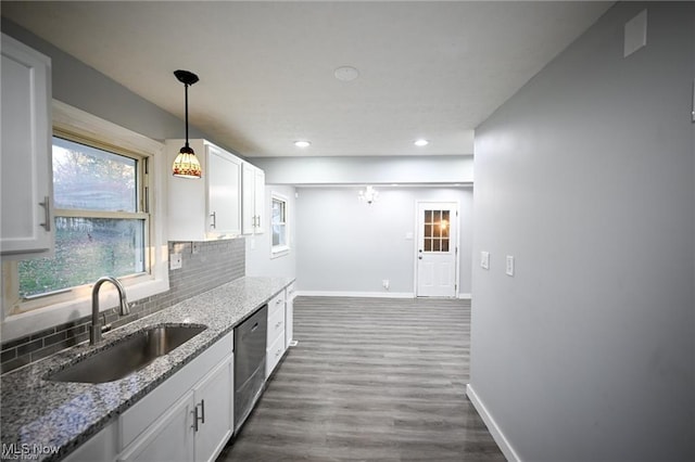 5203 Forest Ave, Maple Heights, OH 44137 - kitchen with dishwasher, white cabinets, decorative backsplash, light stone countertops, and dark wood finished floors