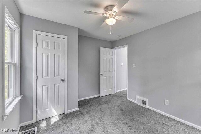 1530 Franklin Ave, Kent, OH 44240 - unfurnished bedroom featuring carpet flooring, multiple windows, and a ceiling fan