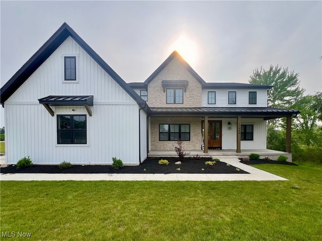 17440 Sawgrass Cir, North Royalton, OH 44133 - modern farmhouse style home featuring a standing seam roof, a metal roof, and a front lawn