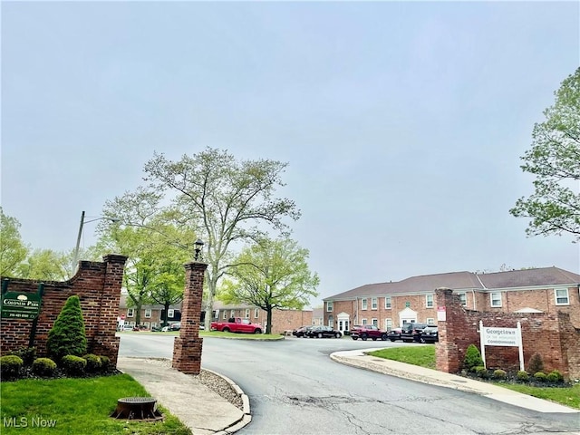 13 Charleston Sq, Euclid, OH 44143 - view of asphalt road with curbs and street lighting