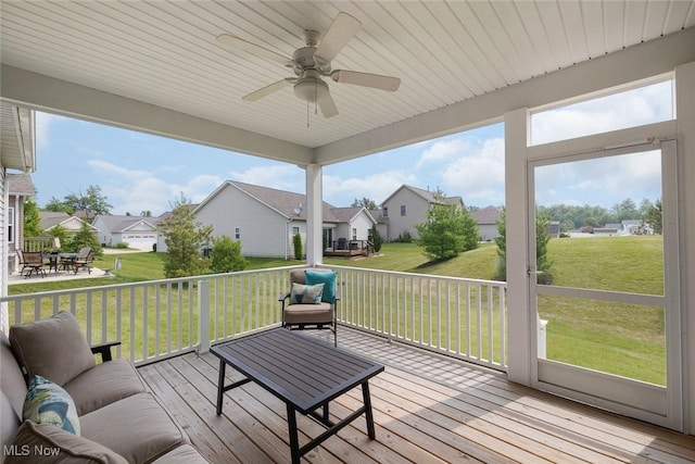 13861 Woodhawk Dr, Strongsville, OH 44136 - wooden deck with a residential view, a ceiling fan, a lawn, and an outdoor living space