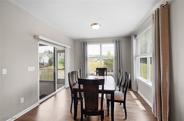 13861 Woodhawk Dr, Strongsville, OH 44136 - dining area with dark wood-type flooring and plenty of natural light