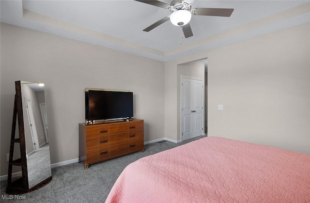 13861 Woodhawk Dr, Strongsville, OH 44136 - carpeted bedroom with a tray ceiling and ceiling fan