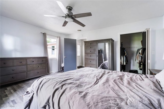 5672 Stanford Ave, Youngstown, OH 44515 - bedroom with wood finished floors, a spacious closet, a closet, and ceiling fan