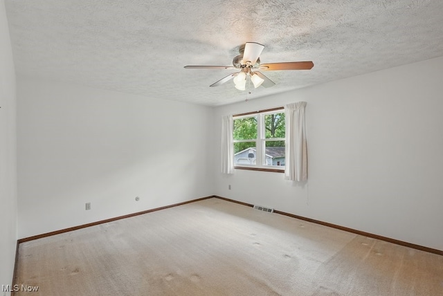 450 S Walnut St, Ravenna, OH 44266 - spare room featuring ceiling fan, a textured ceiling, and carpet flooring