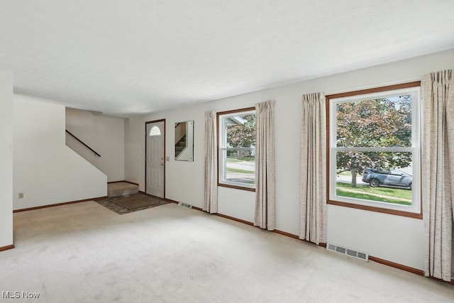 450 S Walnut St, Ravenna, OH 44266 - carpeted entryway featuring baseboards
